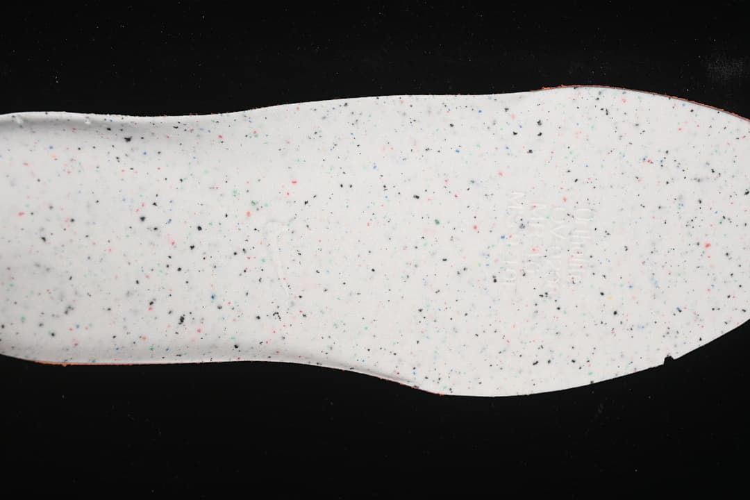 Underside of the shoe's speckled insole
