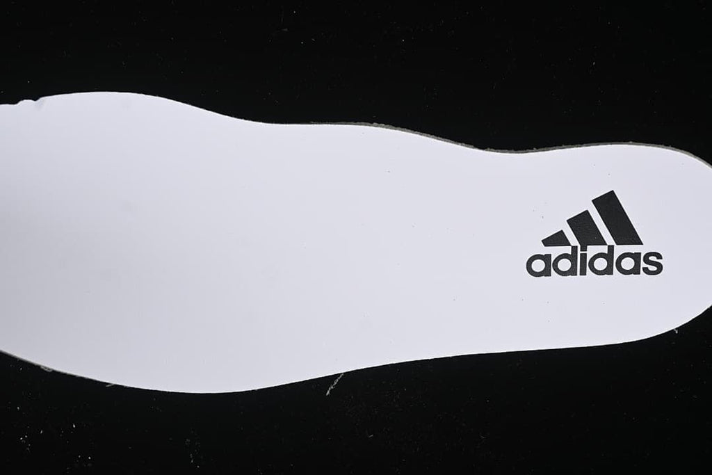 White insole with adidas logo.