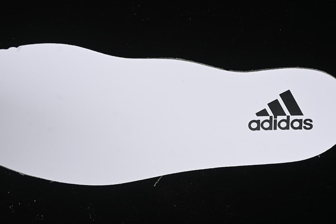 White insole with adidas logo.