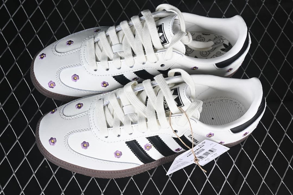 Pair of white floral Samba OG W sneakers with black stripes