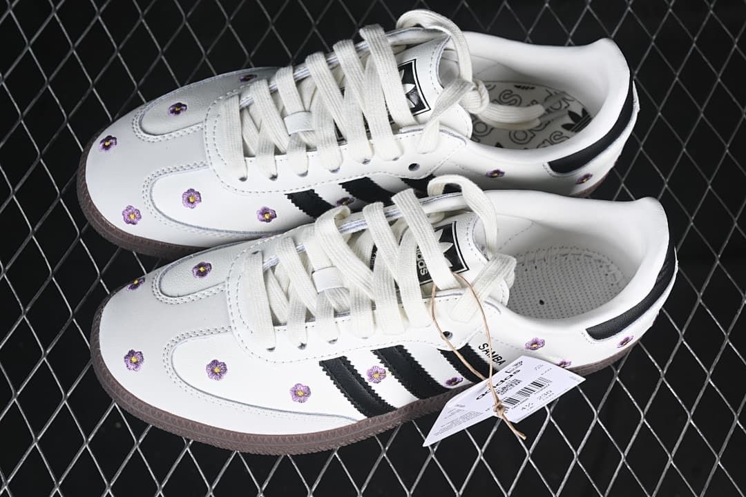 Pair of white floral Samba OG W sneakers with black stripes