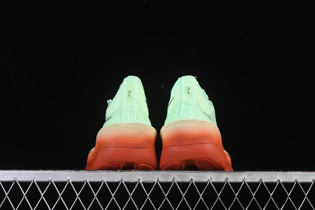 Rear view of both shoes showing the heel and outsole
