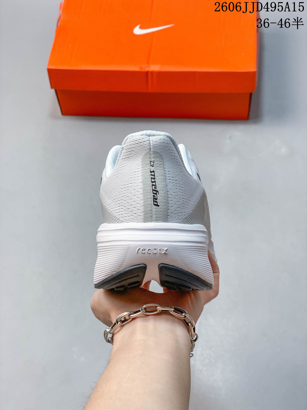 Rear view of a white Nike Pegasus 42 shoe
