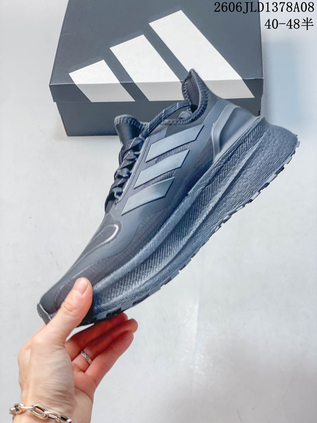Side profile of a grey Adidas Ultraboost 5 Climawarm shoe
