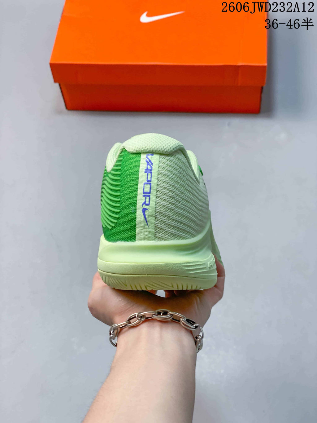 Rear view showing the green and pale cream heel panels