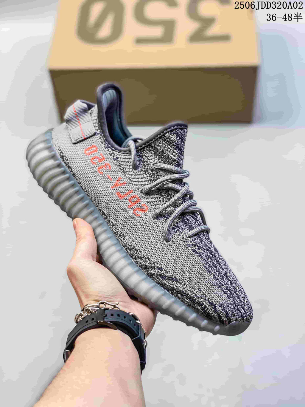 Gray knit-look sneaker with coral lettering and a gray ribbed sole