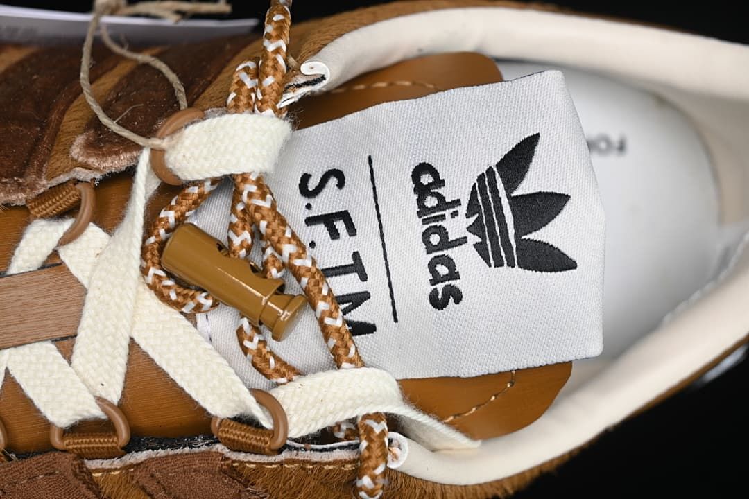 Close-up of adidas S.F.T.M. tongue label and laces