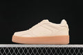 Side view of cream Alo Yoga Recovery Mode low-top sneakers with a gum-tone sole