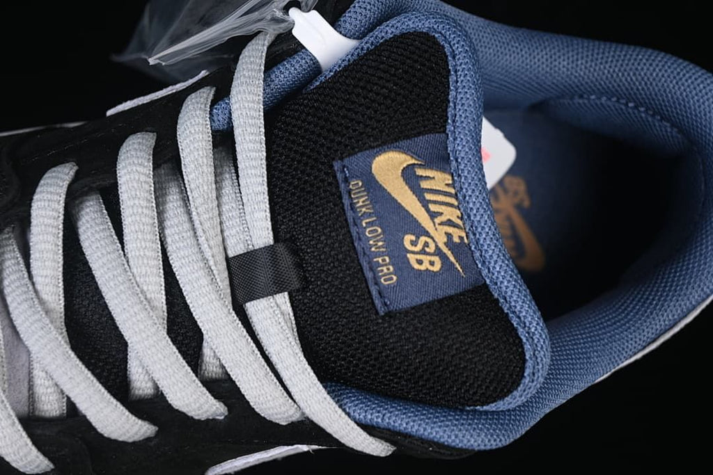 Top detail of the tongue label, laces, and blue padded collar