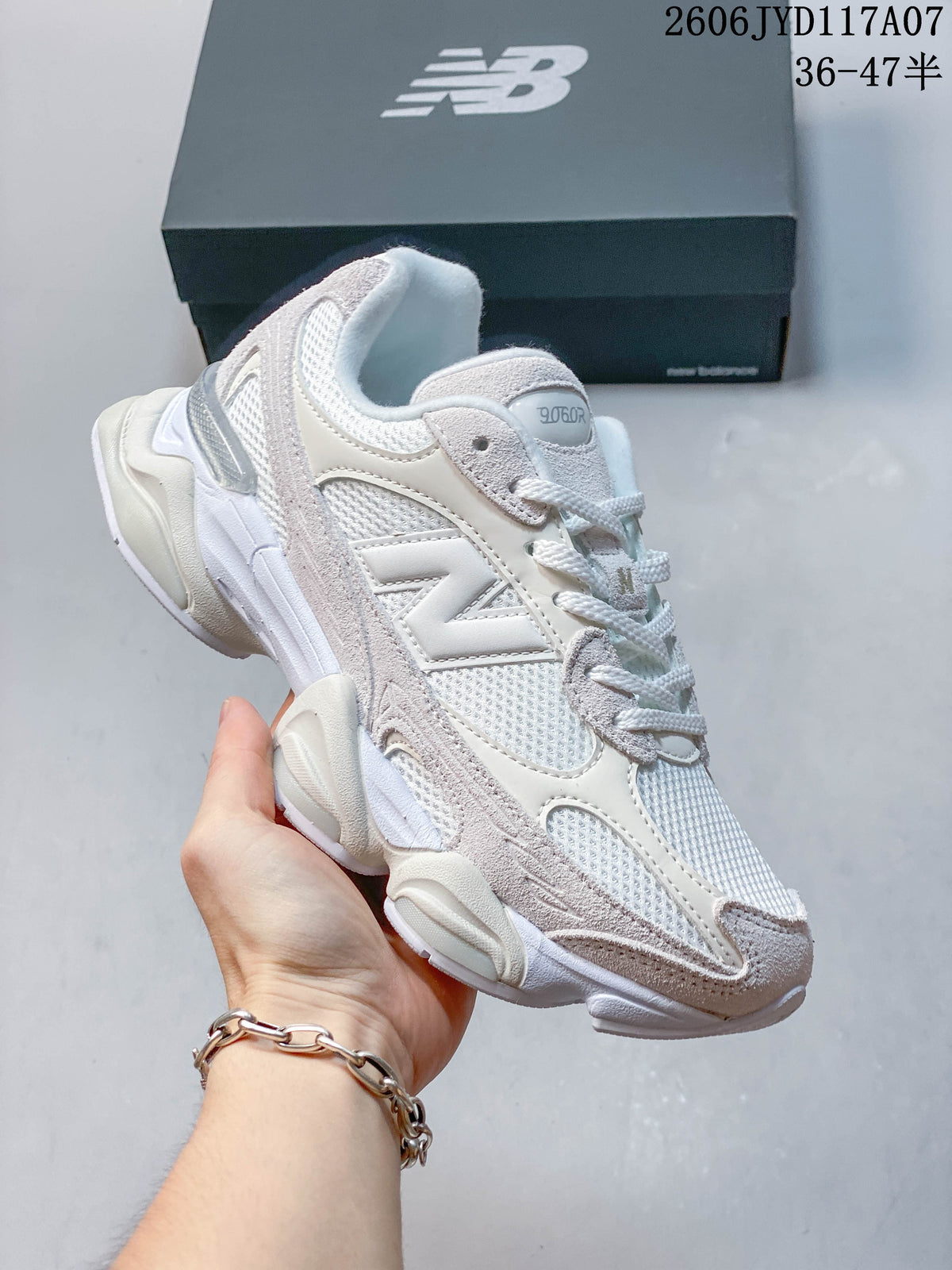 Angled side view of a white and pale grey New Balance 9060R sneaker