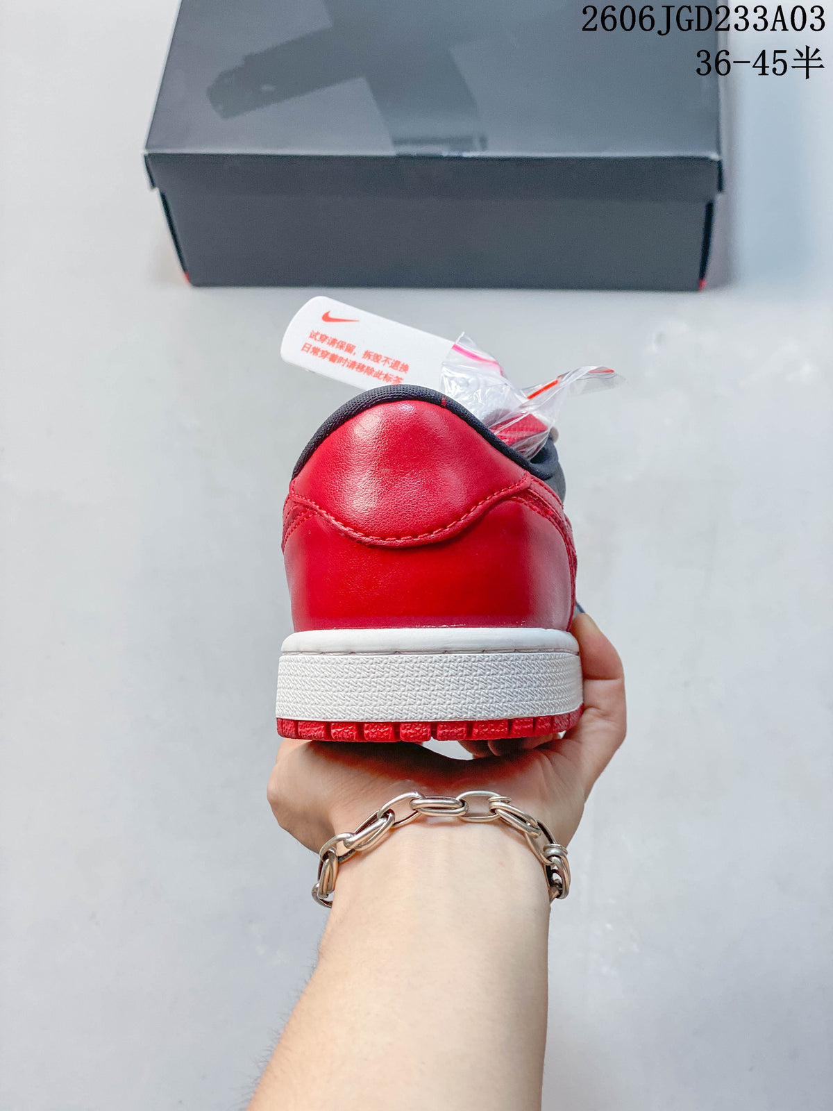 Rear view showing the red heel and white midsole