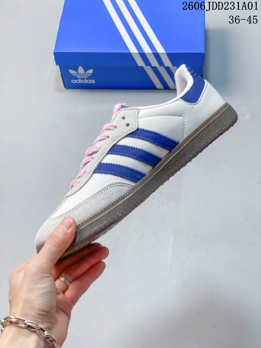 Side view of the off-white sneaker with blue stripes and gum-colored sole