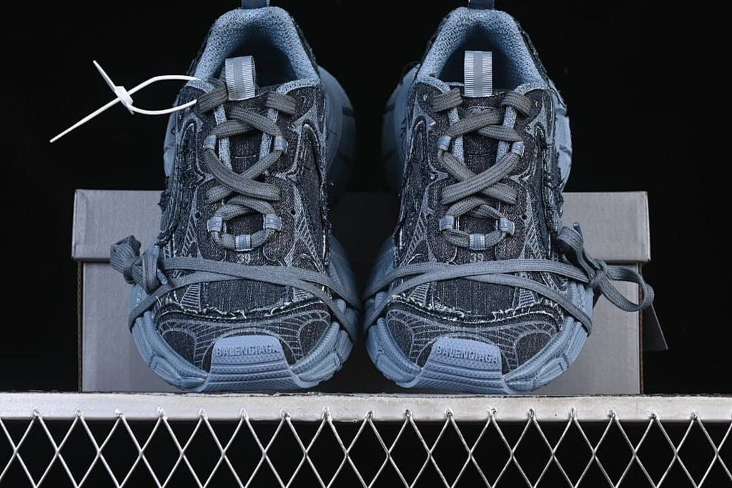 Front view of the pair showing their laces and layered panels