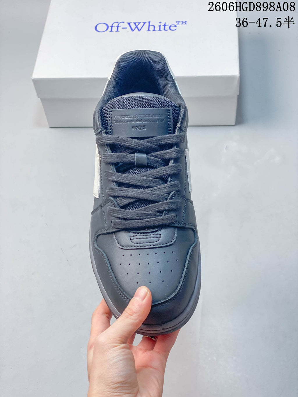 Top view showing the laces, tongue, and perforated toe