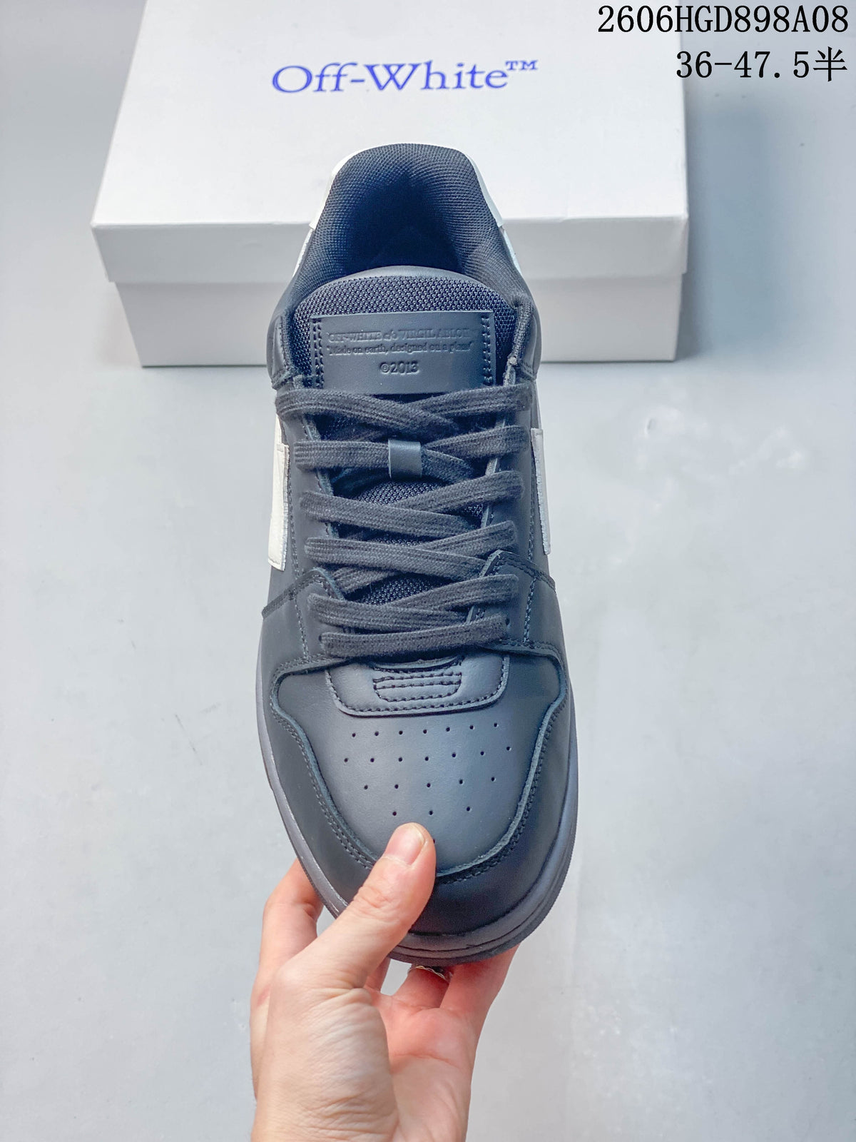 Top view showing the laces, tongue, and perforated toe