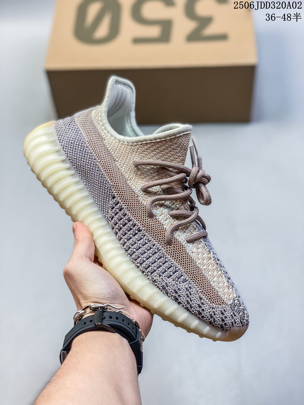Light neutral and gray Adidas Yeezy-style sneaker with a pale ribbed sole