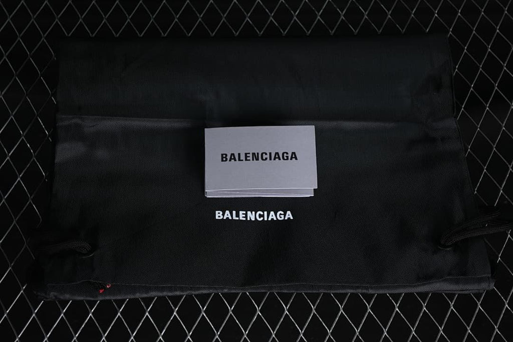Black dust bag and card with Balenciaga branding