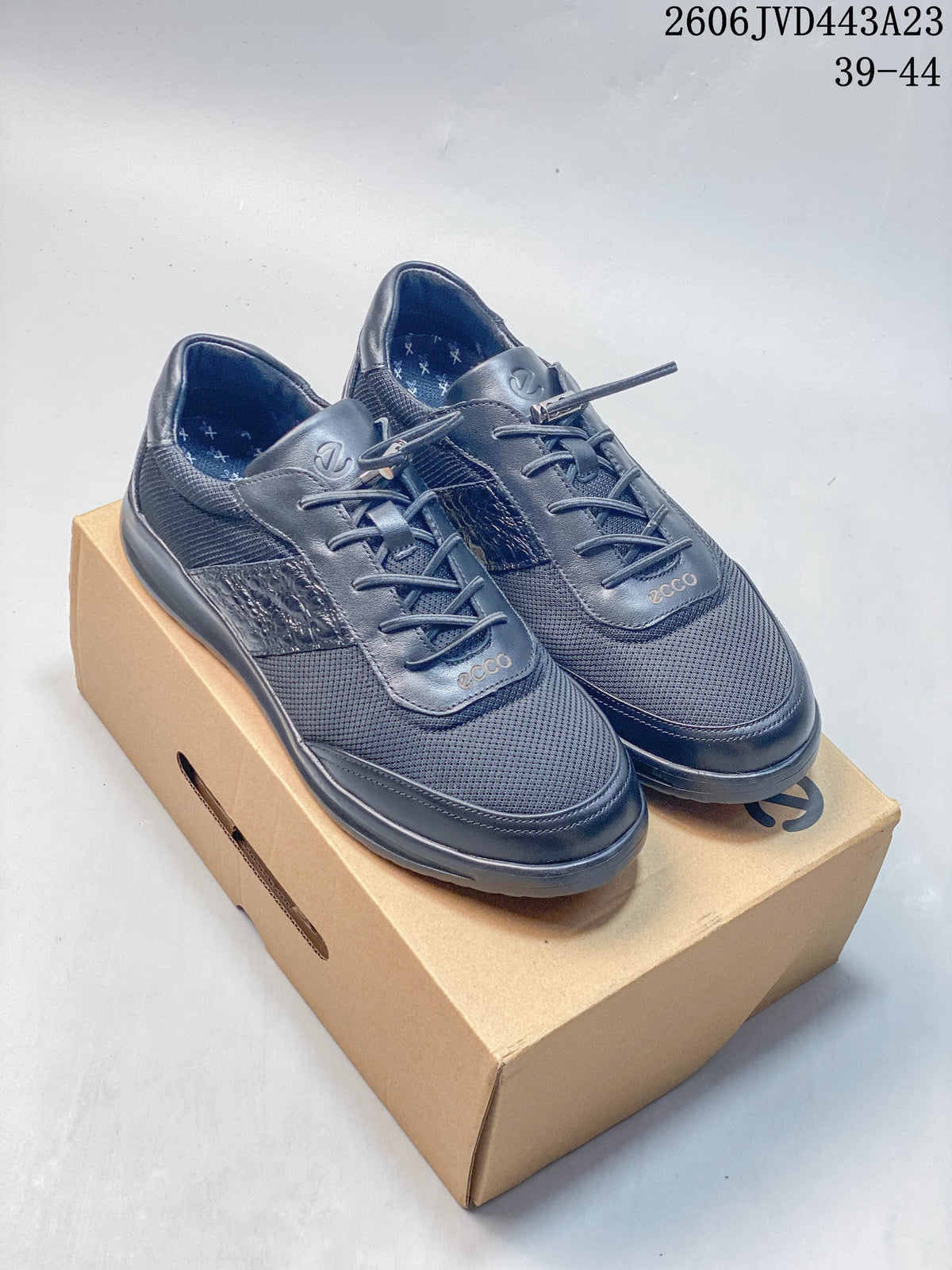 Pair of navy ECCO lace-up sneakers shown from above and at an angle