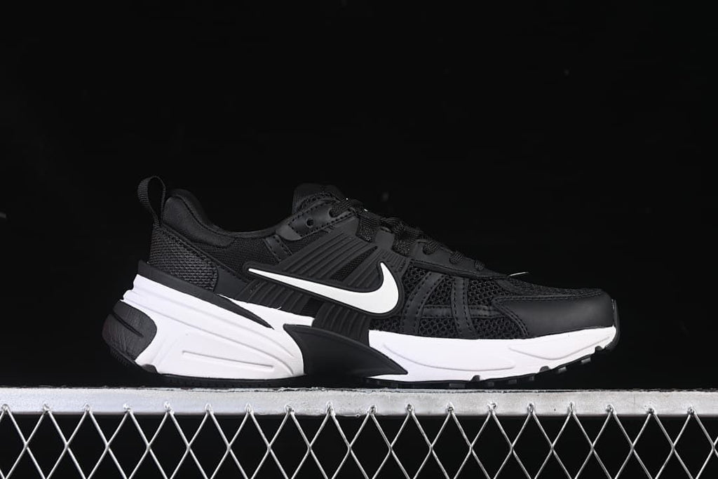 Side profile of a black and white Nike V2K Run shoe.