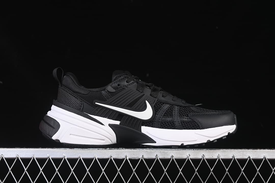 Side profile of a black and white Nike V2K Run shoe.