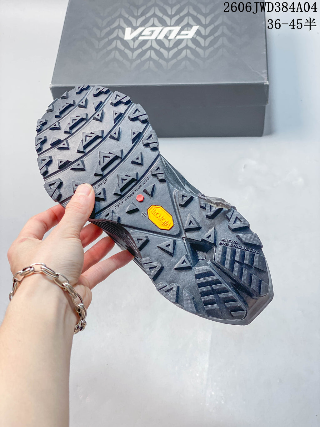 Close-up of the lugged outsole showing the Vibram marking