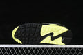 Underside of the Nike Air Max 90 showing its black and volt patterned outsole.