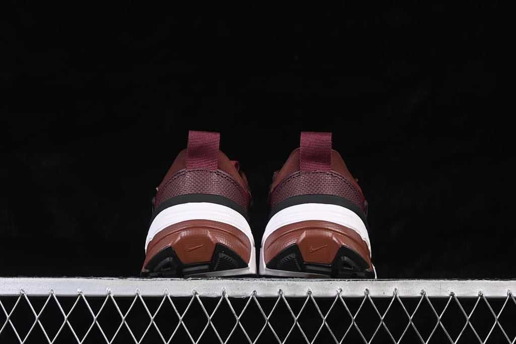 Rear view of both shoes showing the heel and outsole