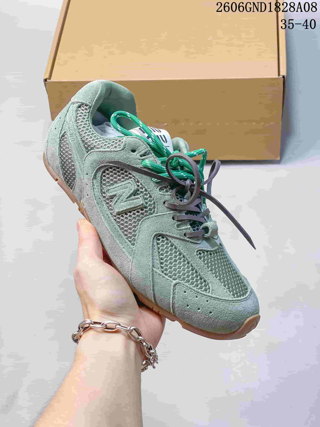 Angled side view of the sneaker with mesh panels, overlays and a gum-colored sole.
