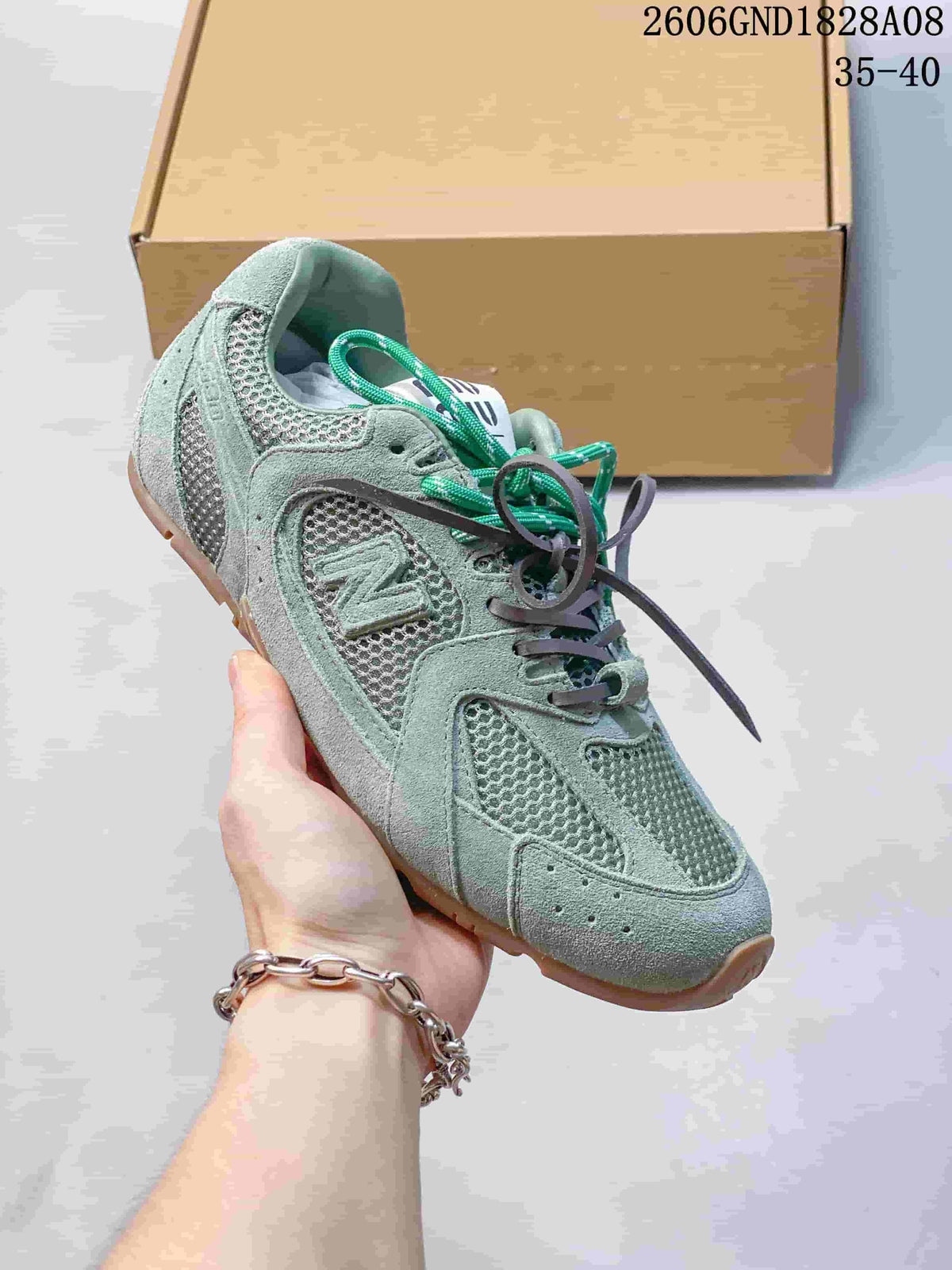 Angled side view of the sneaker with mesh panels, overlays and a gum-colored sole.