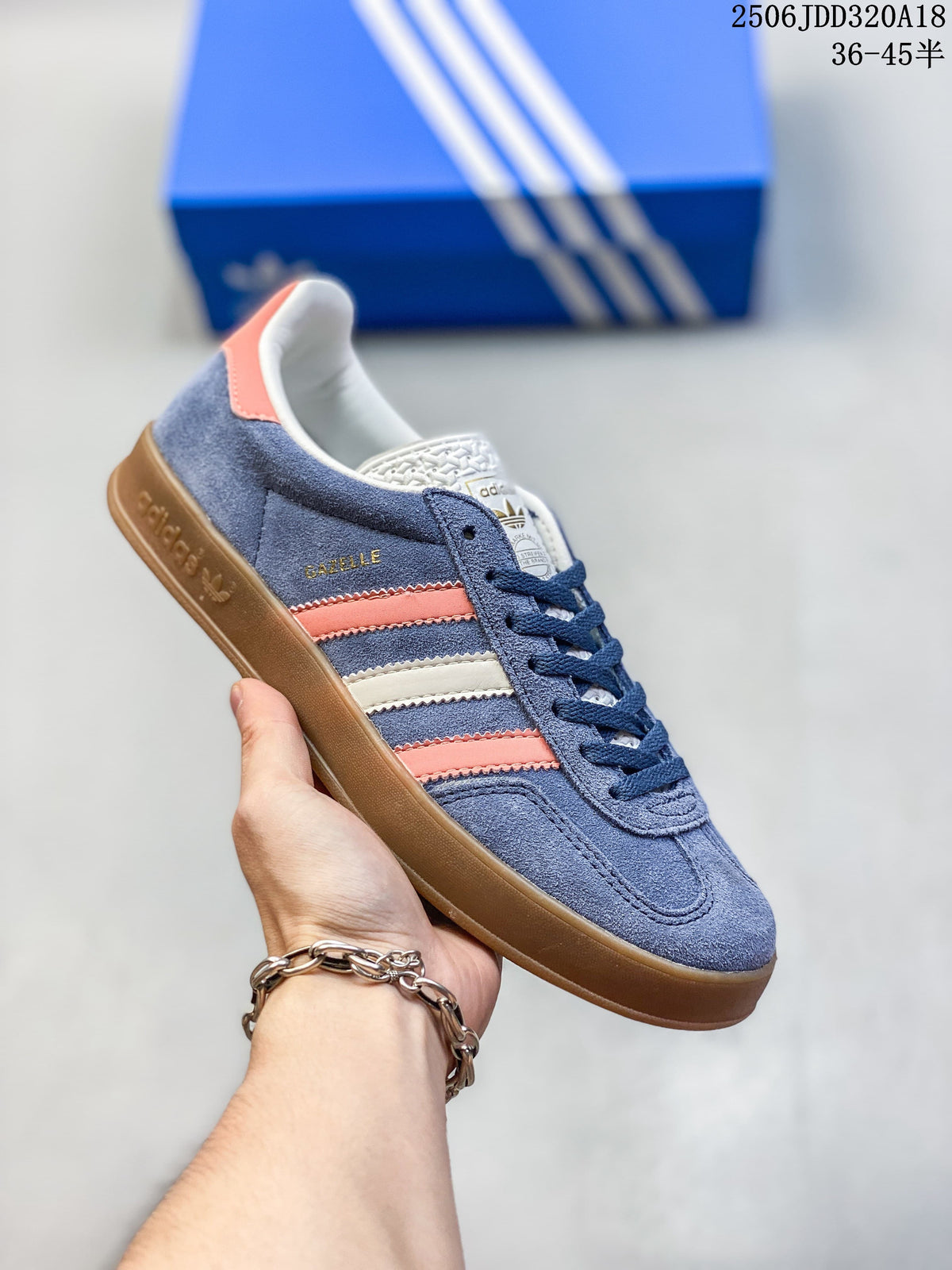 Blue Adidas Gazelle low-top sneaker with coral and cream stripes and a brown sole