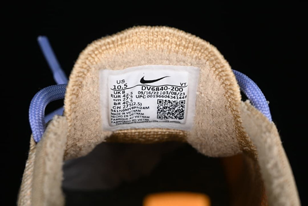 Tongue size label showing US 10.5, UK 8, EUR 42.5, CM 27.5 and style code DV6840-200.