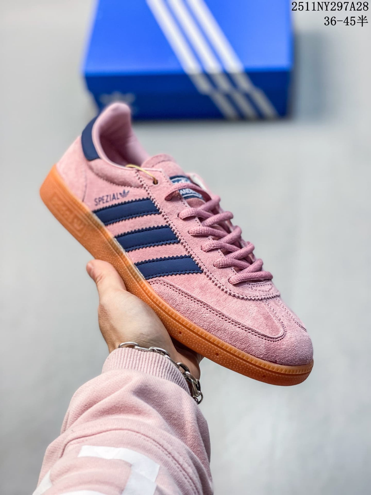 Pink adidas Handball Spezial sneaker with navy stripes and a gum outsole