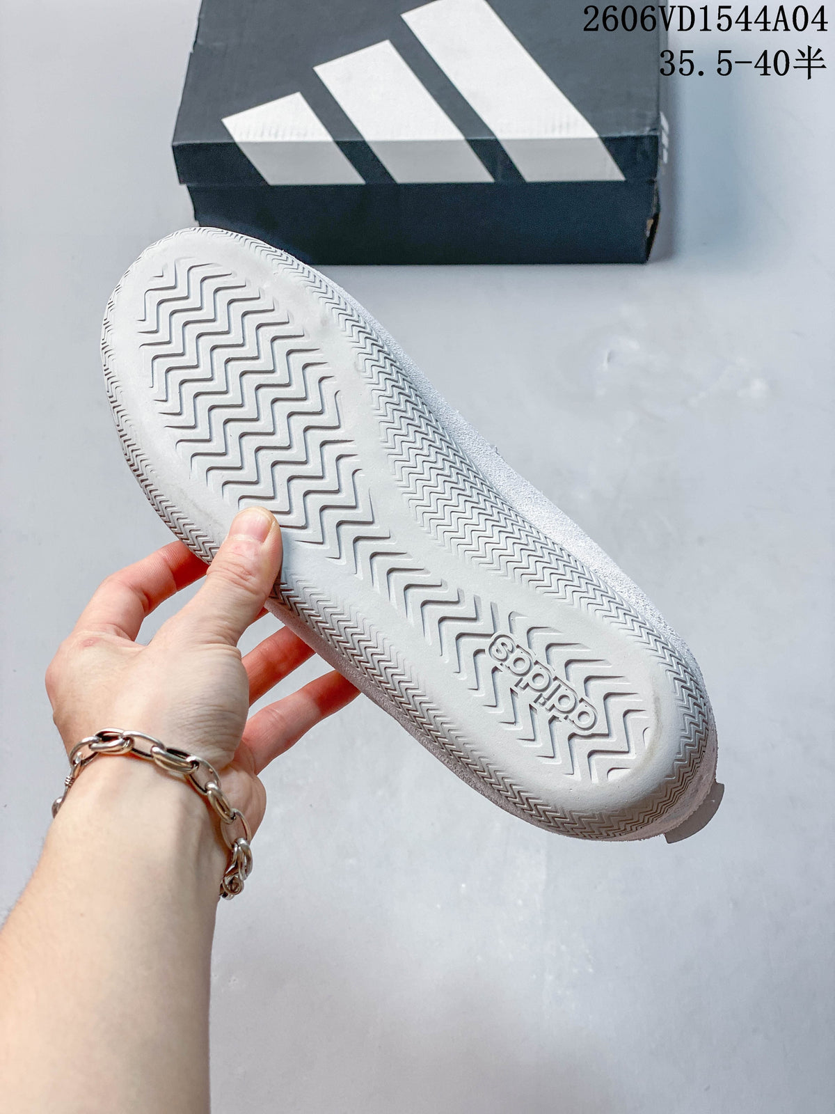 Close-up of the Adidas sneaker outsole with a zigzag tread pattern