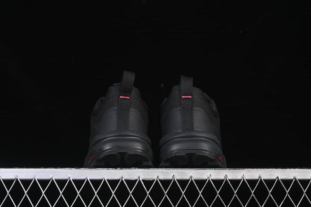 Rear view of the pair showing heel loops and outsole edges
