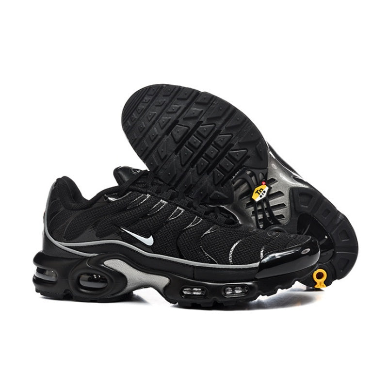 Black Nike Air Max Plus sneakers shown from the side and outsole, with gray accents.