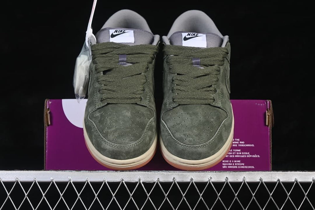 Front view of the pair showing perforated toe boxes and olive-green laces