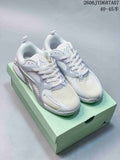 White and light gray Jordan Heir PF shoes shown from above on a mint-colored box.