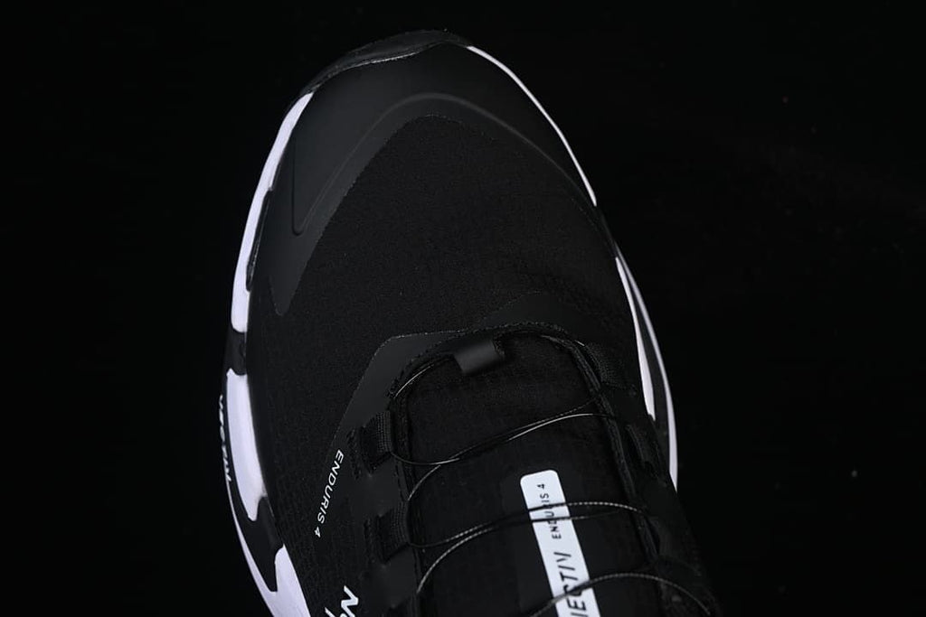 Top-down view of the black toe and lacing area.