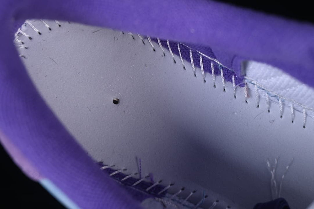 Close-up of the interior stitching and purple lining