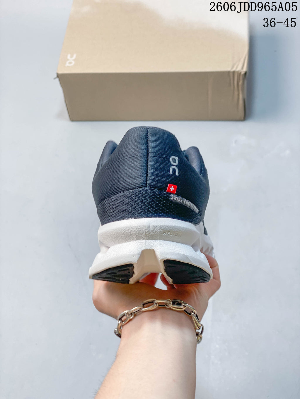 Rear view of the navy shoe with white sole