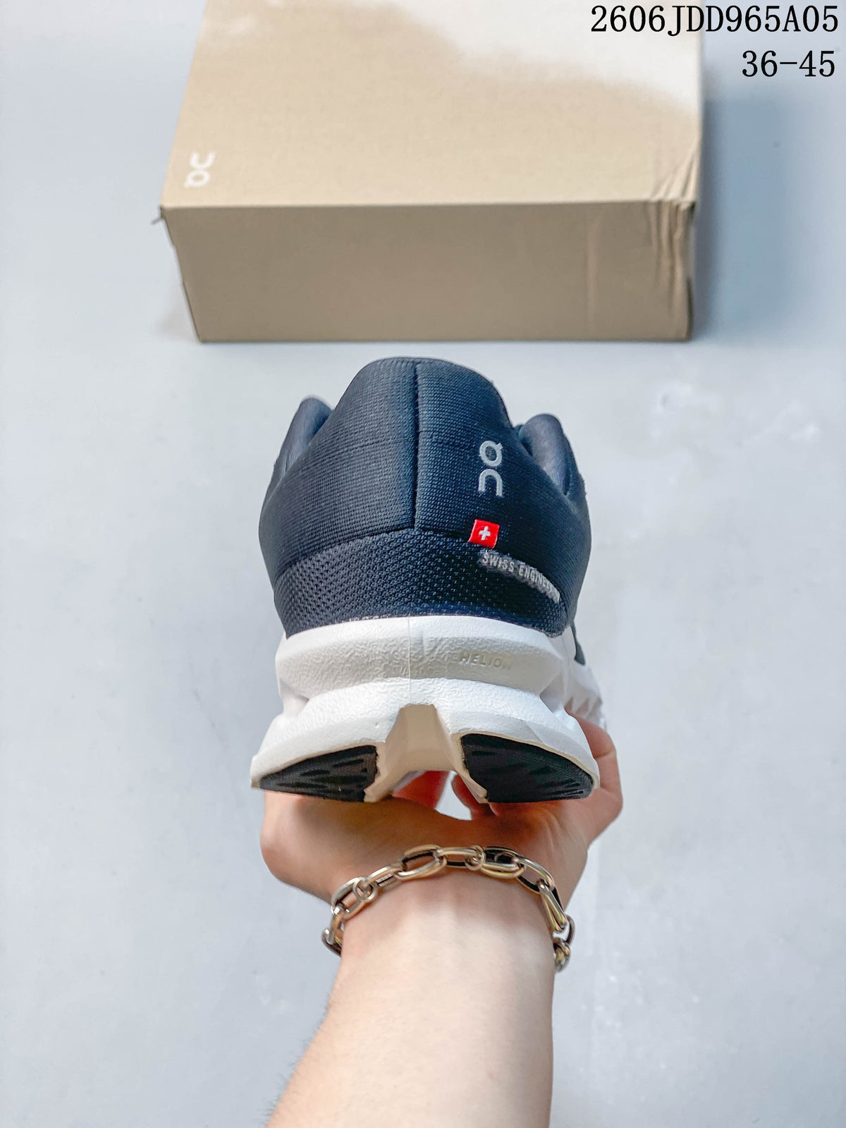 Rear view of the navy shoe with white sole