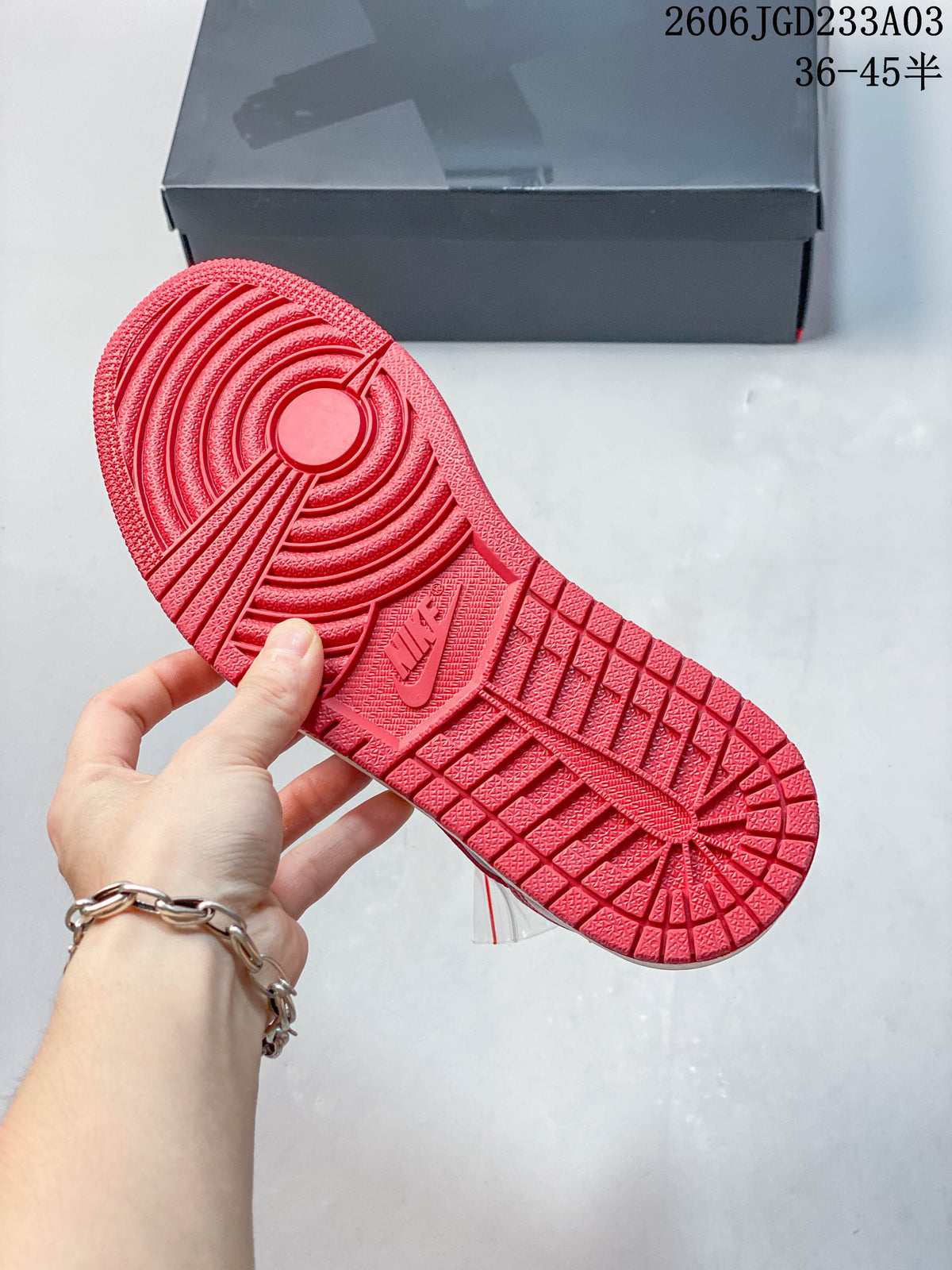 Red patterned outsole of a low-top sneaker