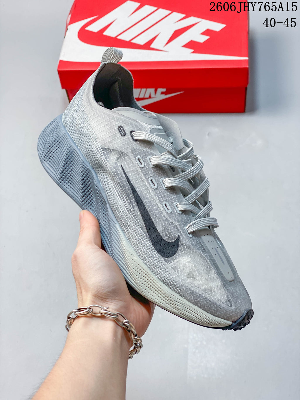 Angled side view of the grey Nike Ava Rover shoe