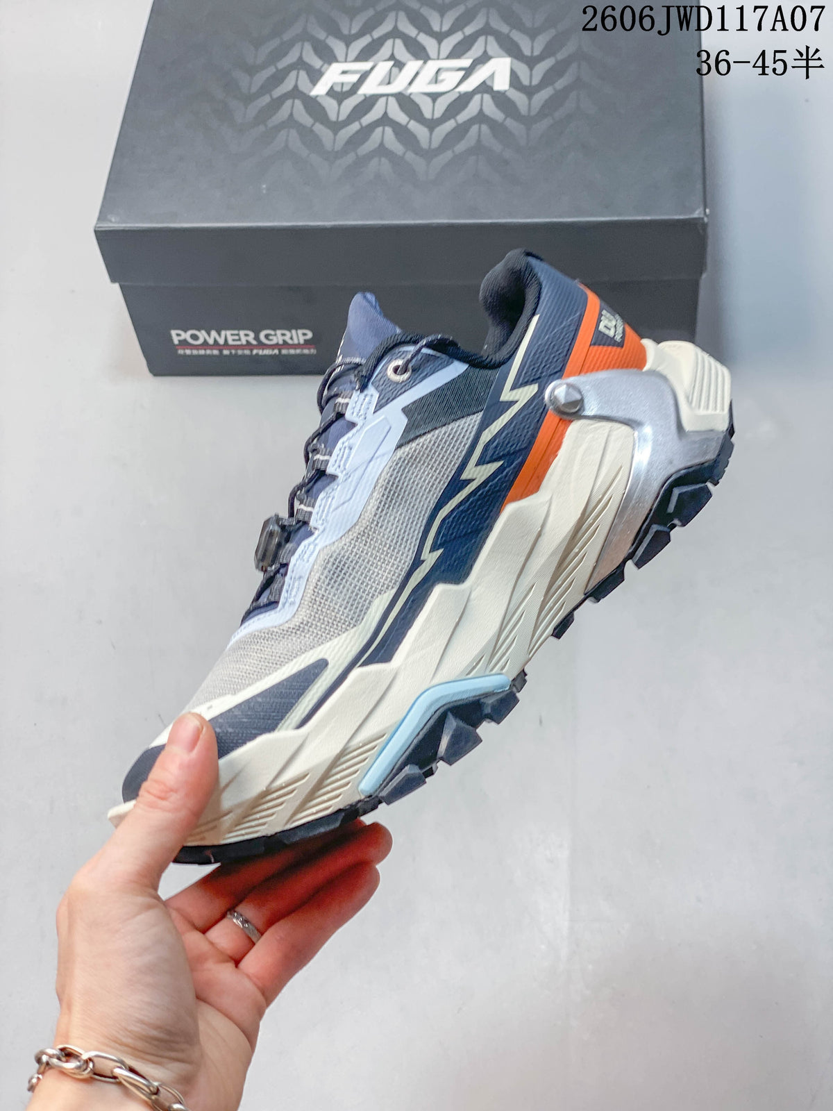 Side view of the trail running shoe with gray, navy, pale blue, cream, and orange details