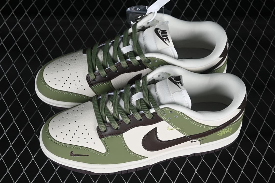 Top view of a pair of olive green and off-white low-top sneakers with green laces