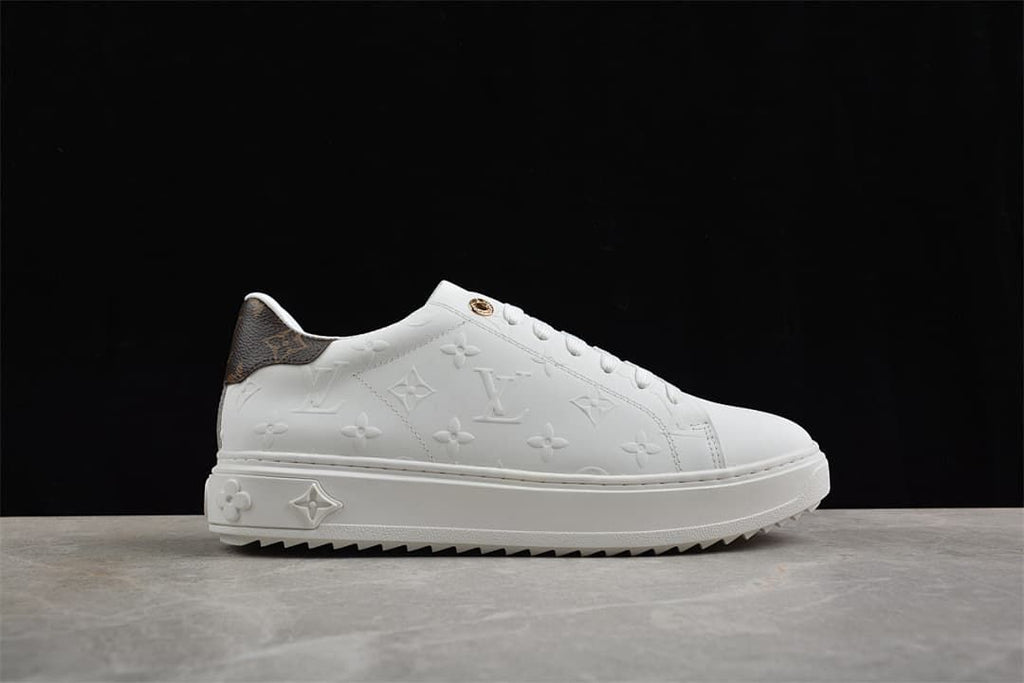 Opposite side profile of the white embossed sneaker