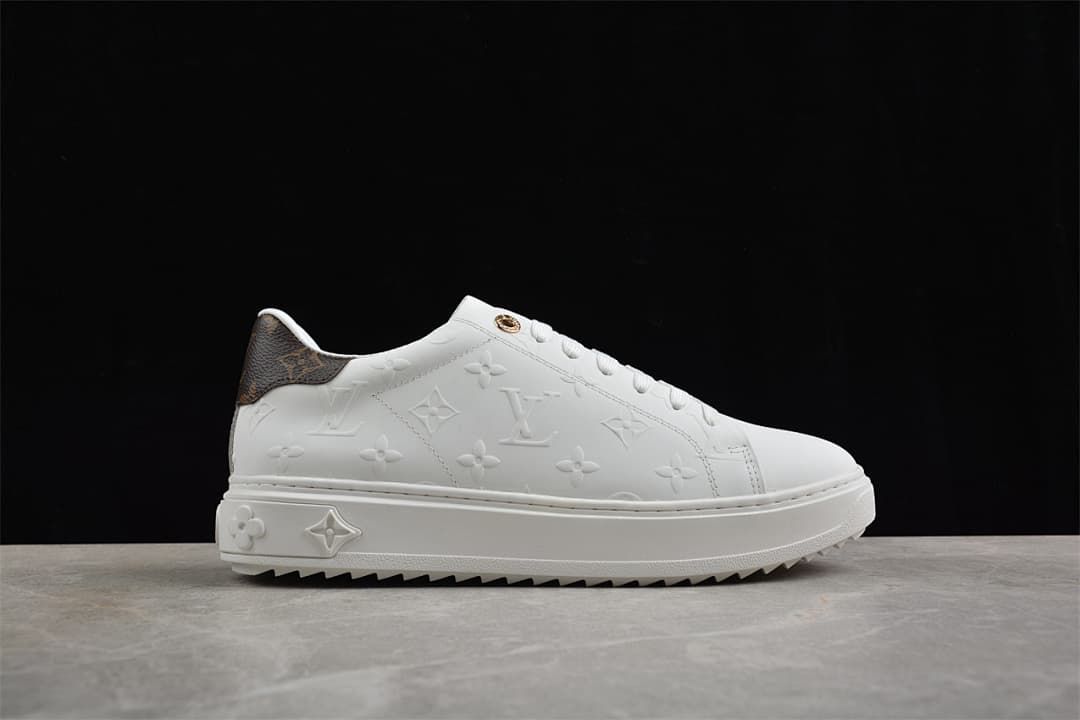 Opposite side profile of the white embossed sneaker
