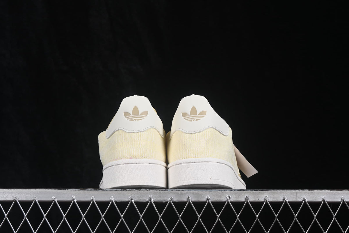 Rear view of the pair showing the white heel panels and Trefoil logos.