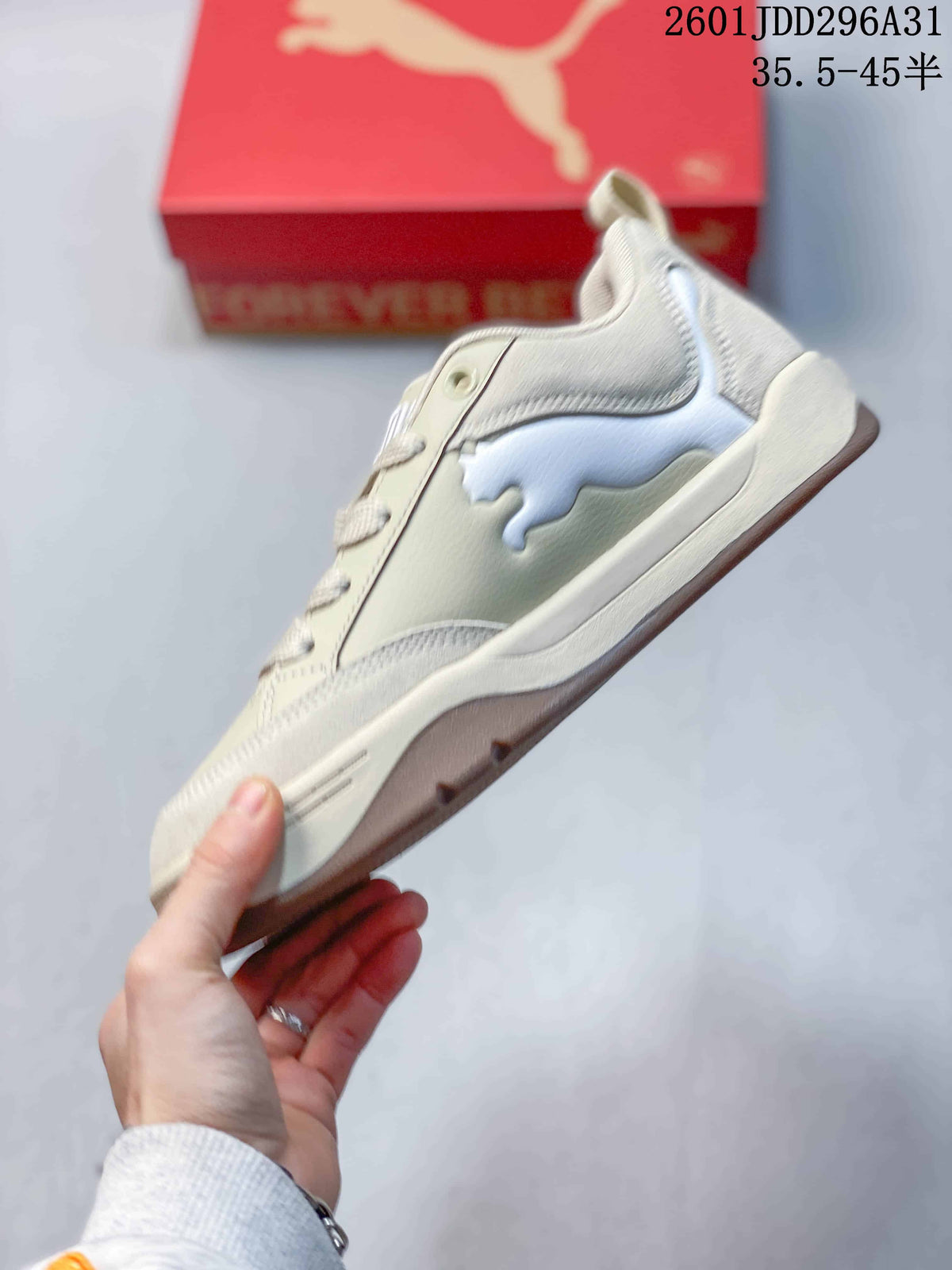 Side view of a cream and white PUMA 180 sneaker with a chunky sole