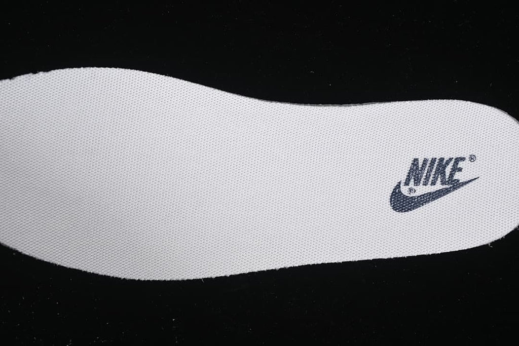 White insole with a navy Nike logo